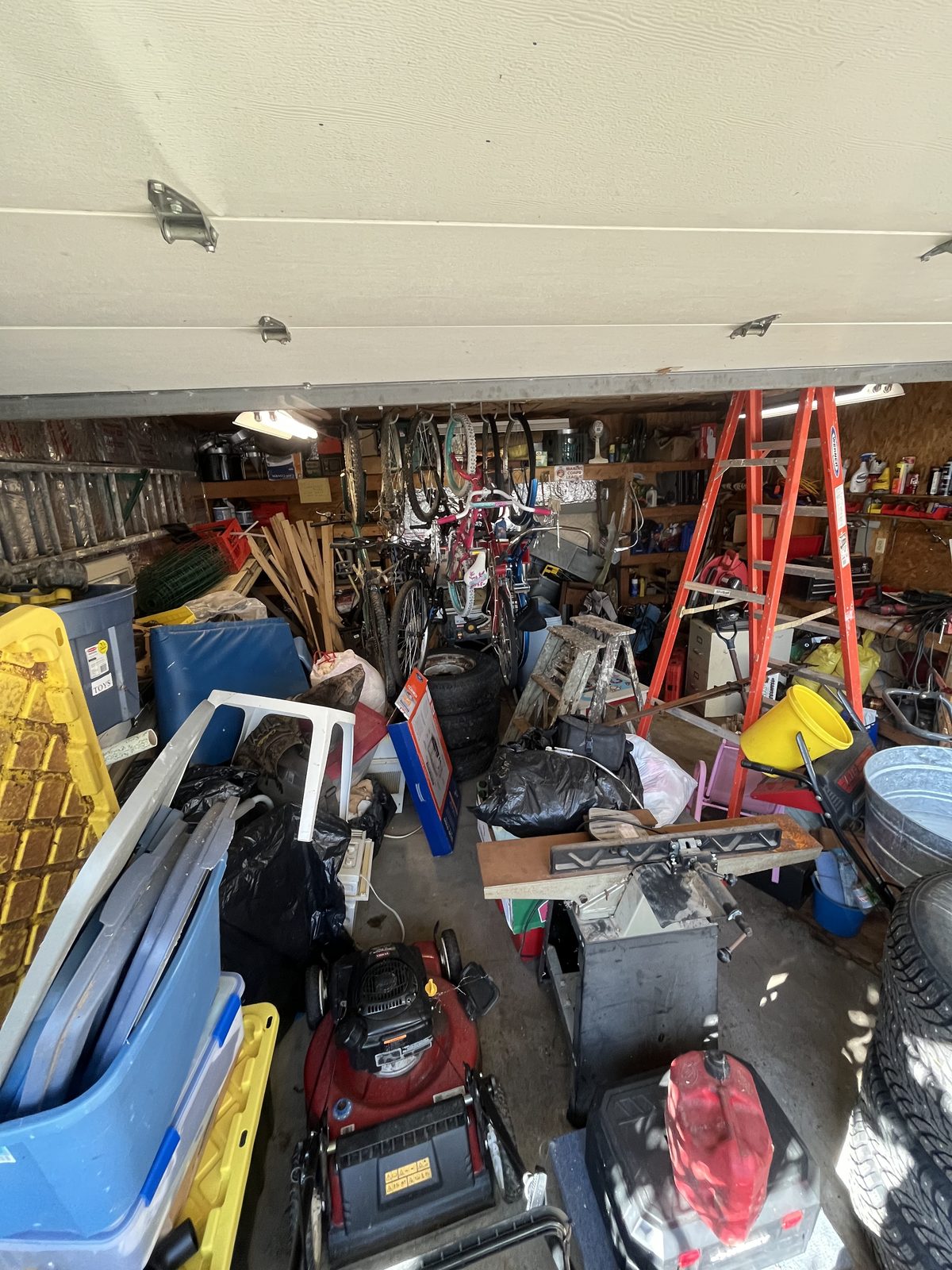 Garage before clean-out — view from outside, completely packed